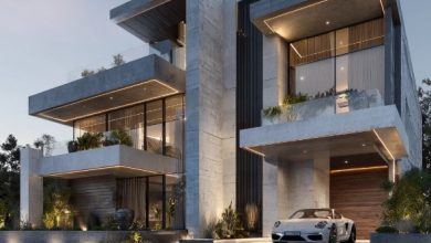 Reforma Alto Padrão: Fachada moderna com concreto, vidro e iluminação de destaque.